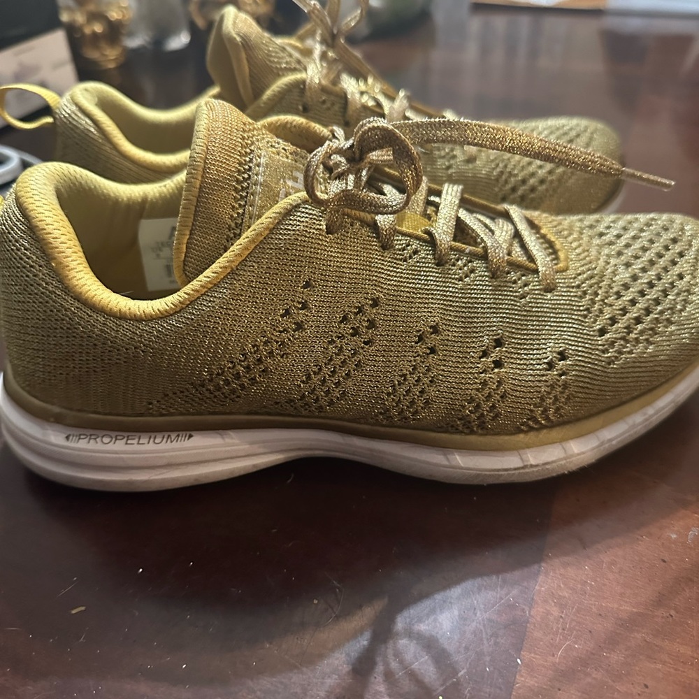 Gold APL sneakers